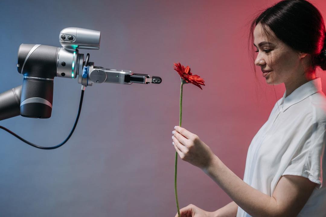 Robot hands human a flower